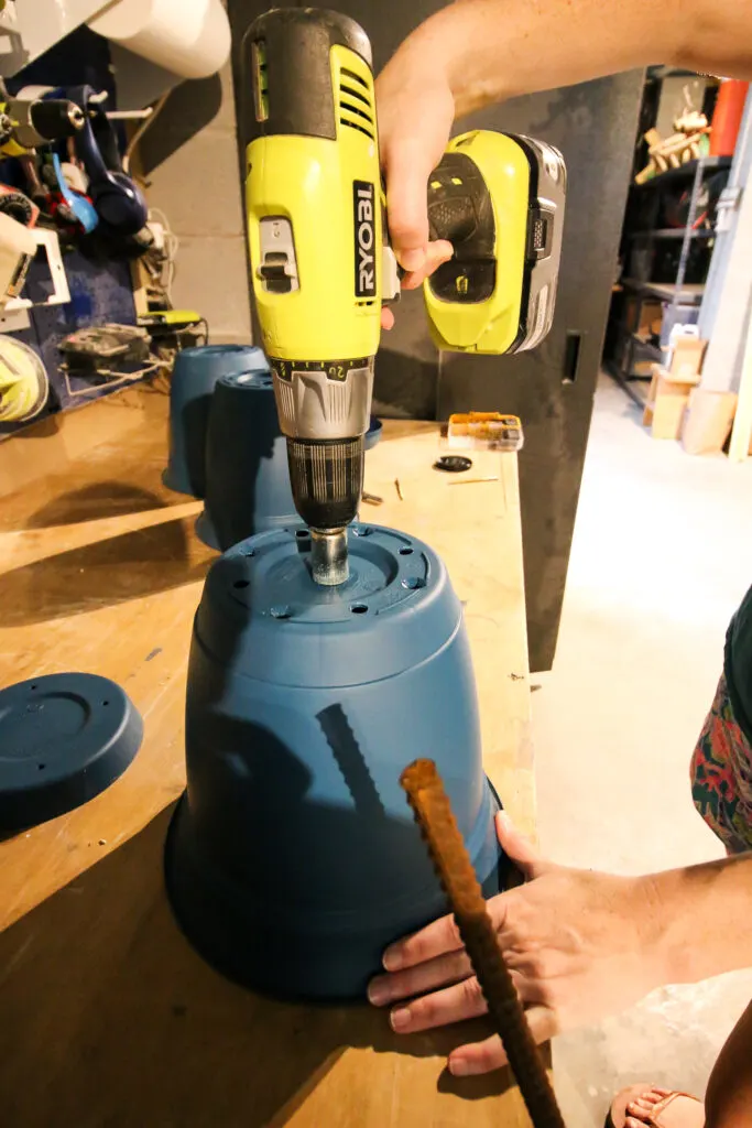 drilling holes in a plastic pot